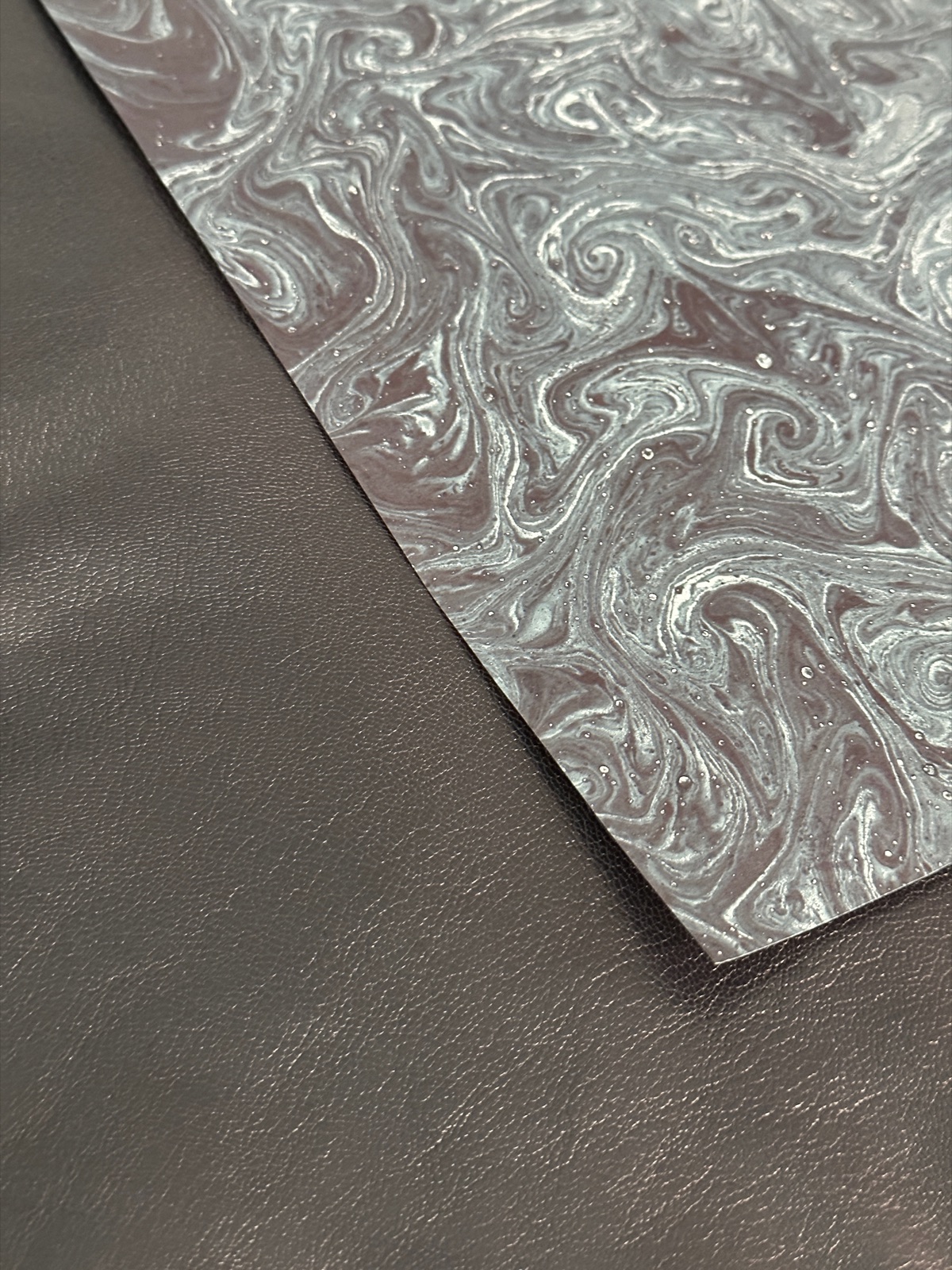 Black leather and black marbled paper