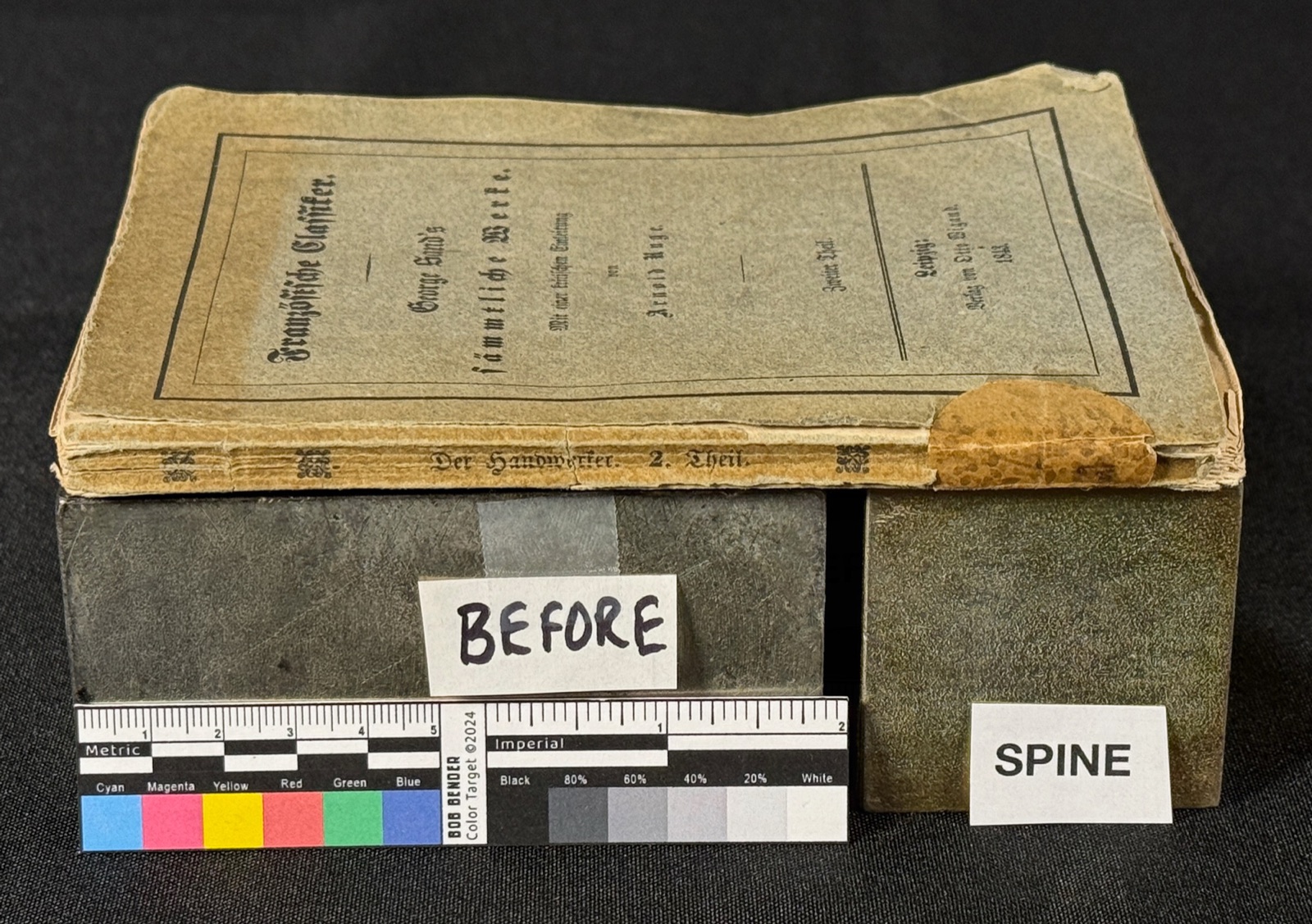 An 1843 German Essays book: worn, torn paper covers and a damaged spine, photographed with a color calibration target.