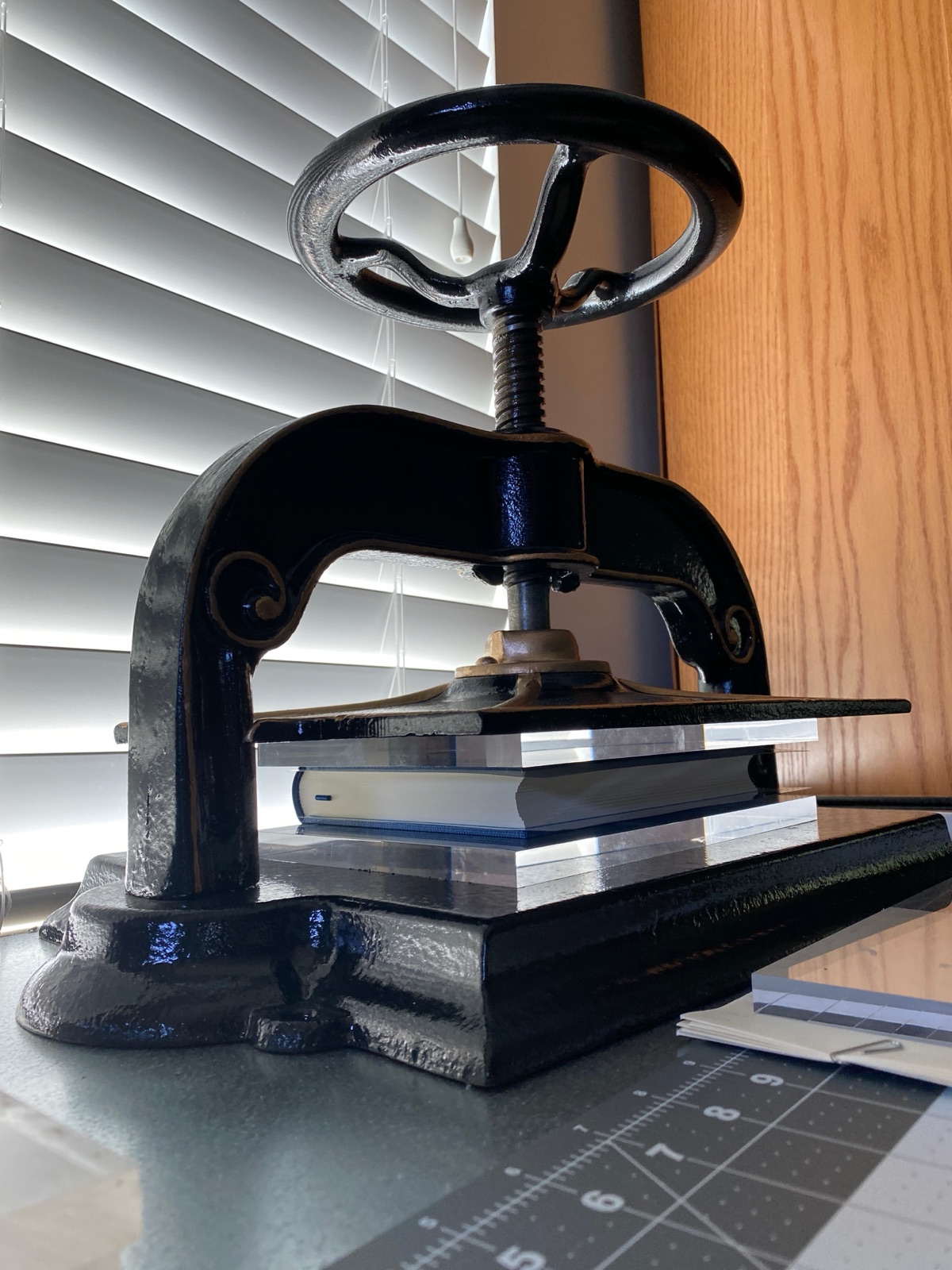 A book inside of a black letter press