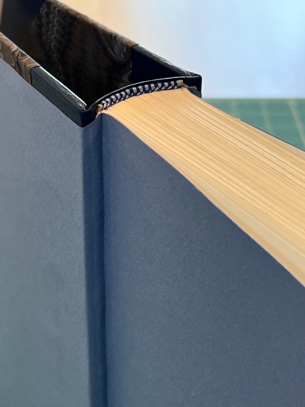 close up of complete book opened to let the final end sheet adhesives to dry