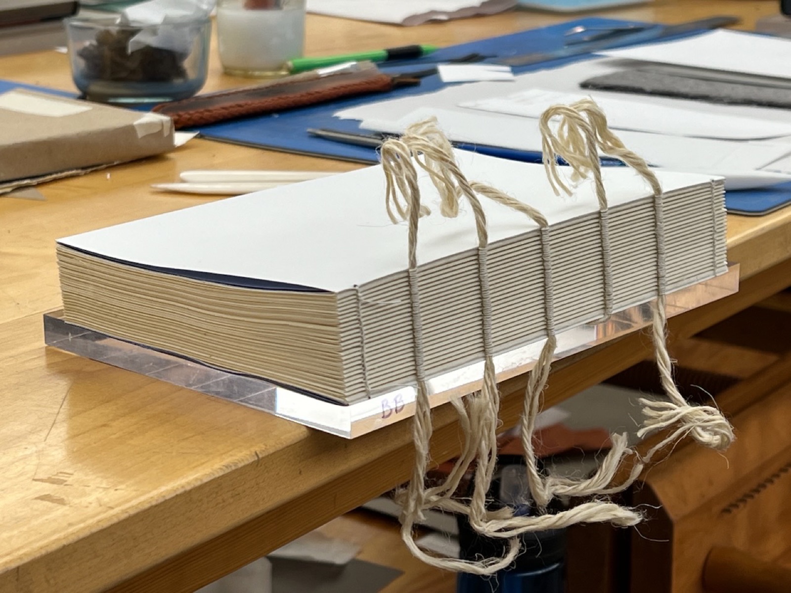 text block showing cords sewn to the block.