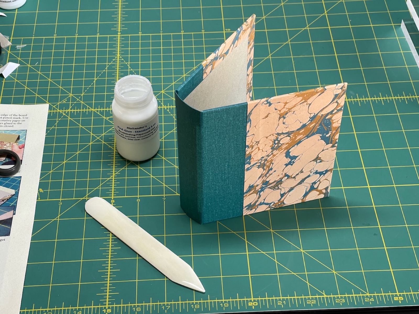 teal and marble case cover complete and standing on mat