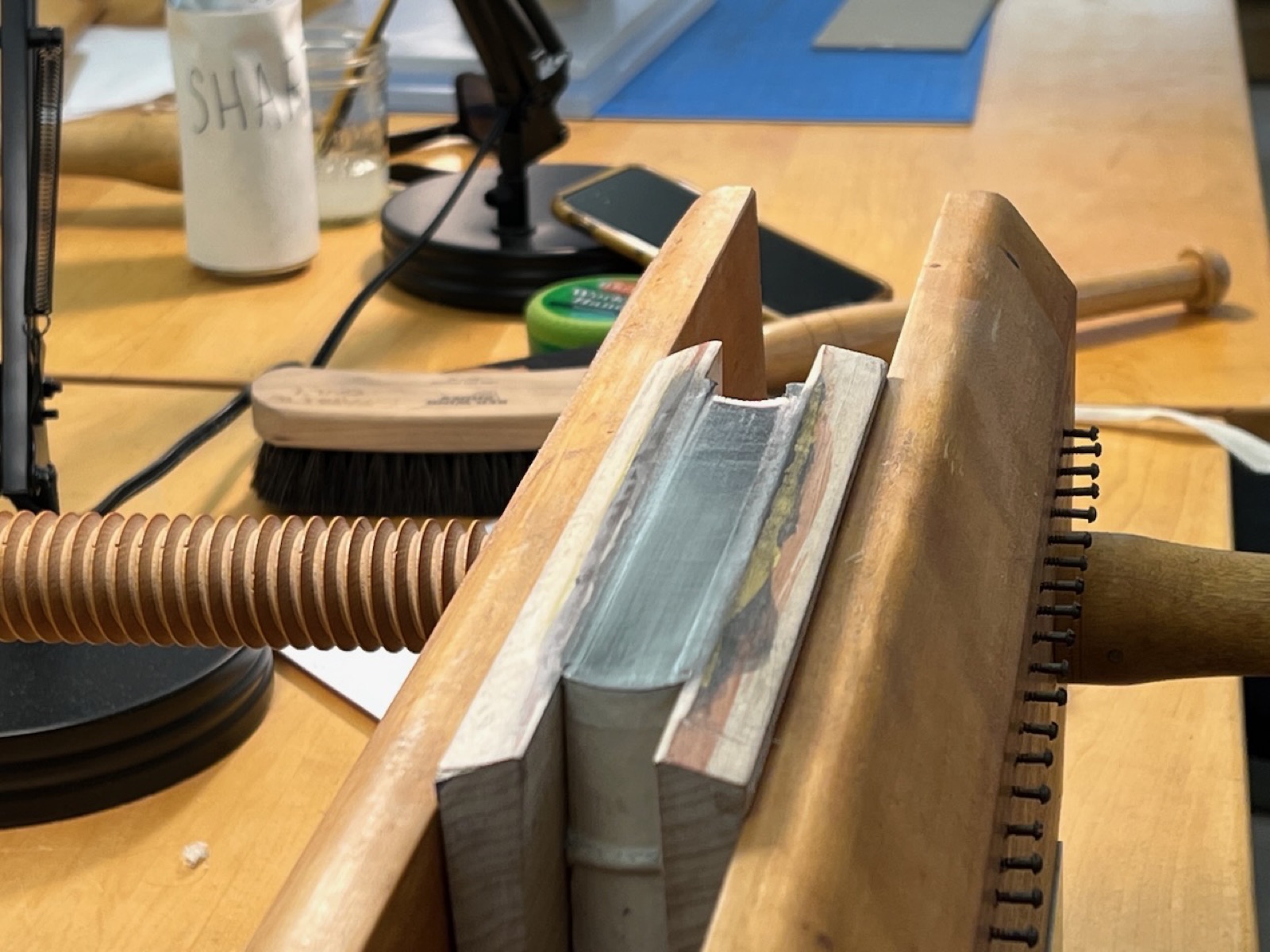 The head of a book with graphite applied to smooth surface.