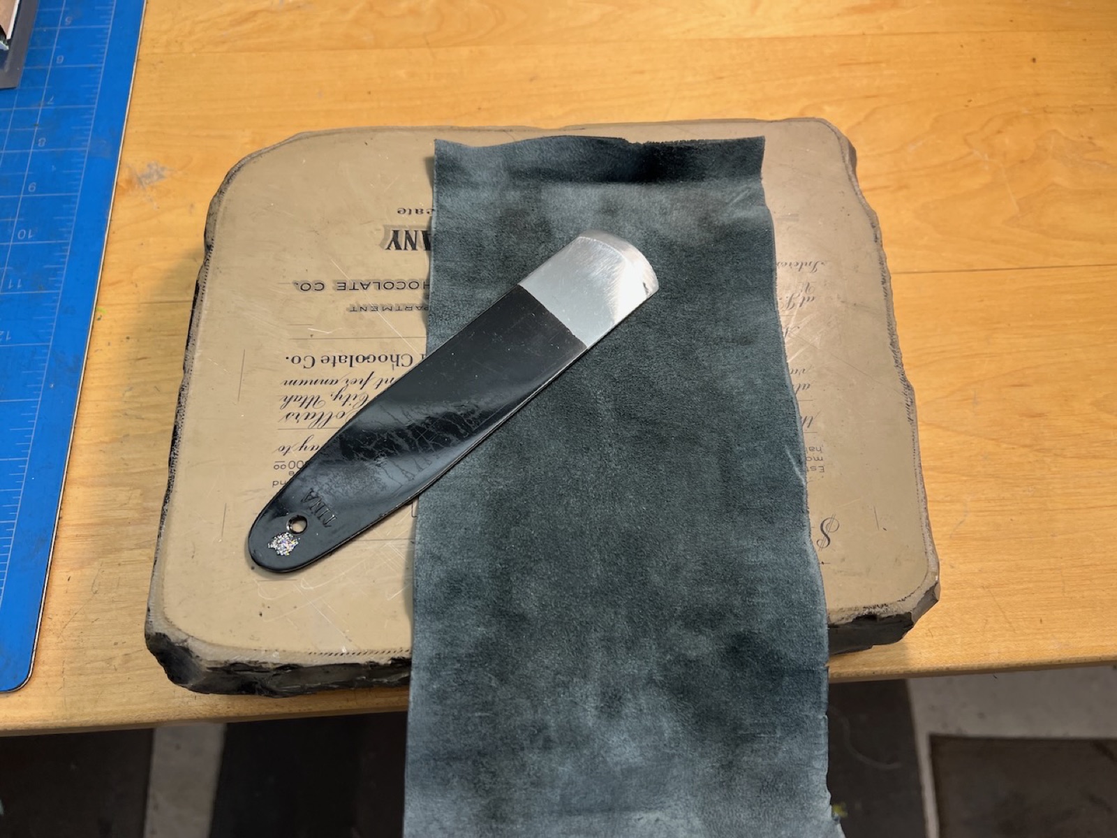 Leather and paring knife on a lithostone.