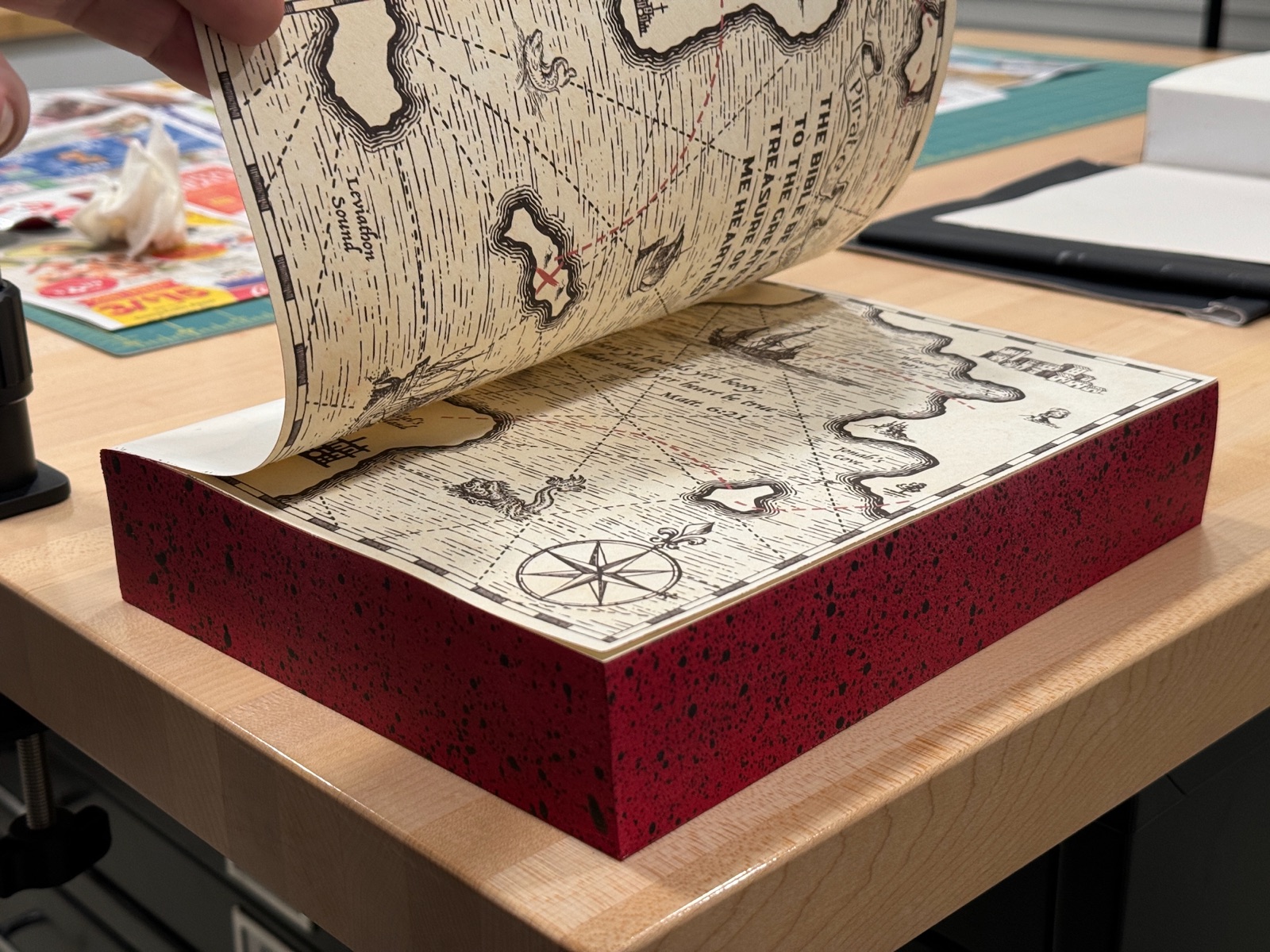 front end papers opened from book revealing pirate map end sheets