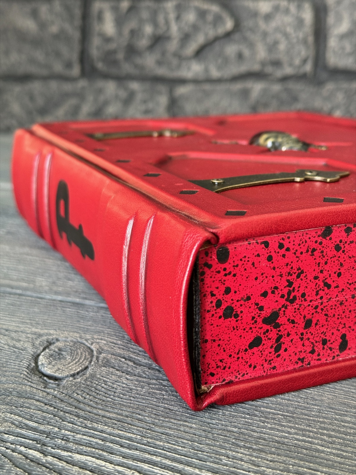 close up of the red and black bottom and spine of the pirate bible