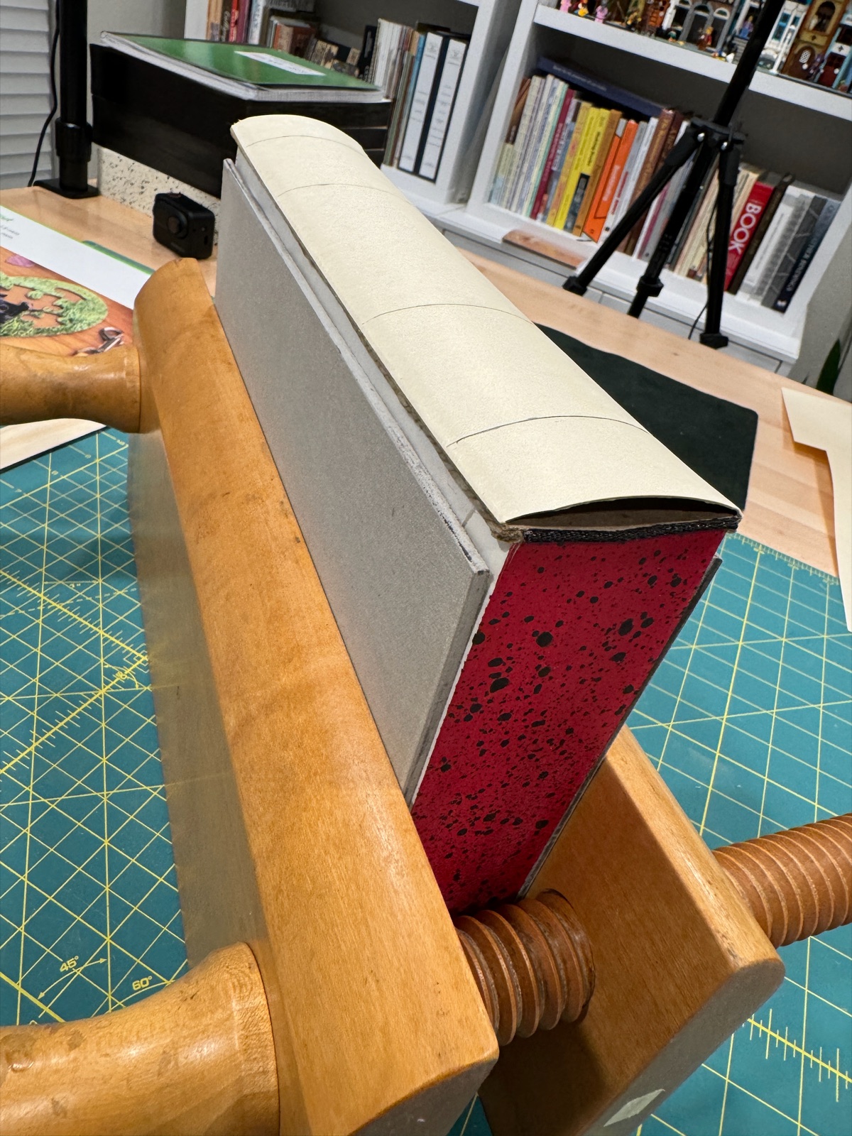 pirate book in wooden press showing the spine hollow