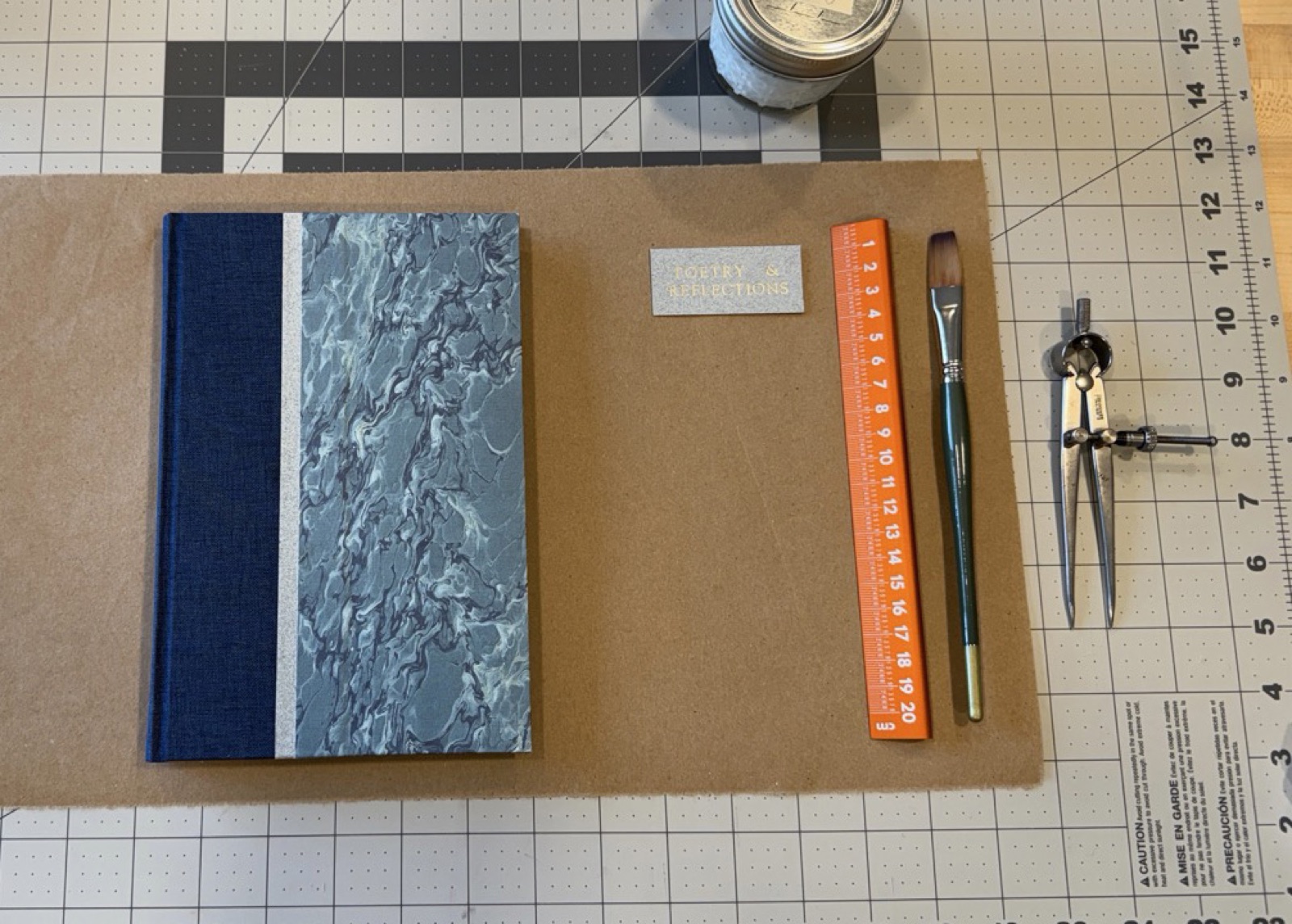 A printed label and a bound book ready for glueing a paper label to the book.