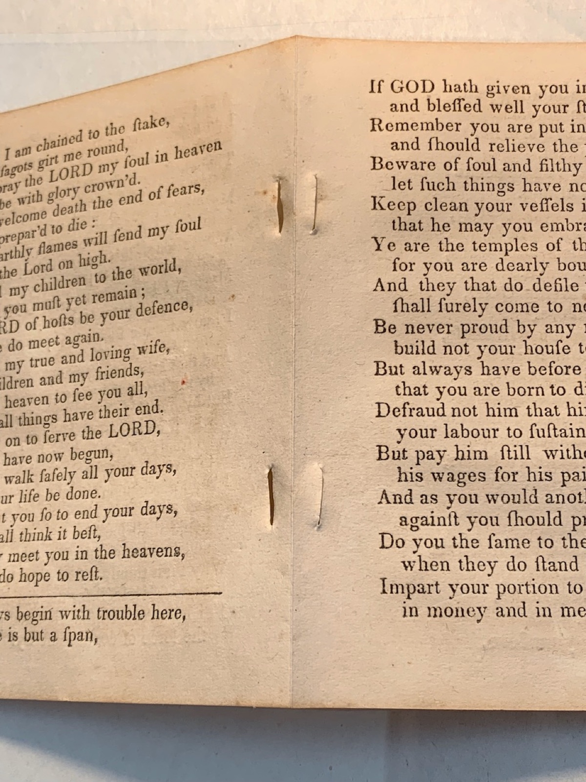 a close up of the pages of a book showing cuts on each page needing repair