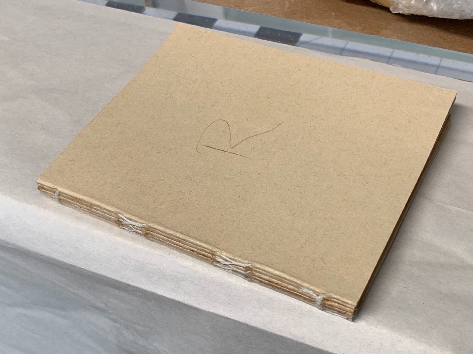 a completely sewn primer book with new tan end sheets