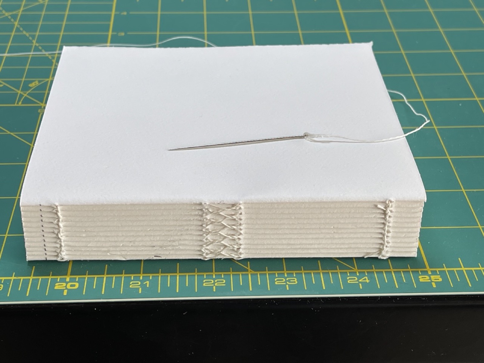Hand sewn tex block white papers