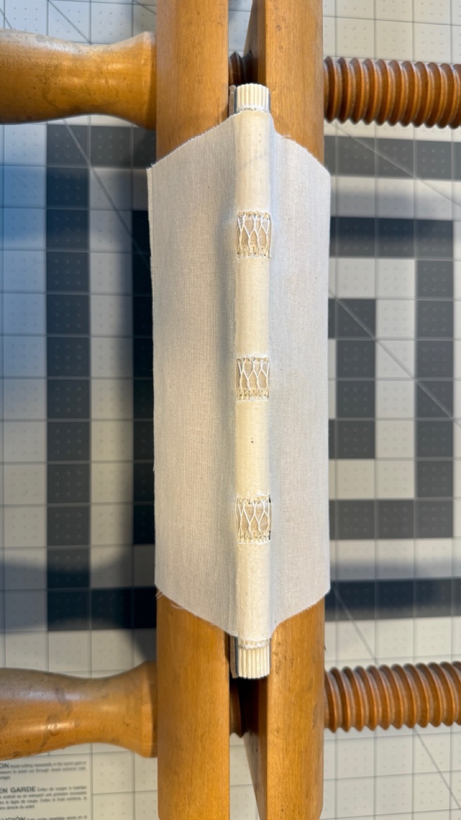 Linen muslin as a spine treatment on the spine of a text block.