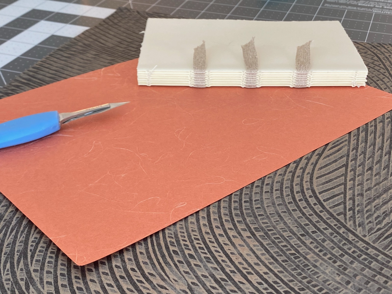 reddish brown textured paper and text block