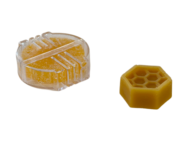 A block of beeswax for thread.