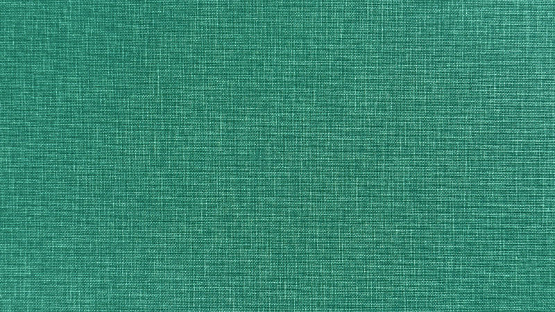 A swatch of green buckram showing its tight weave.