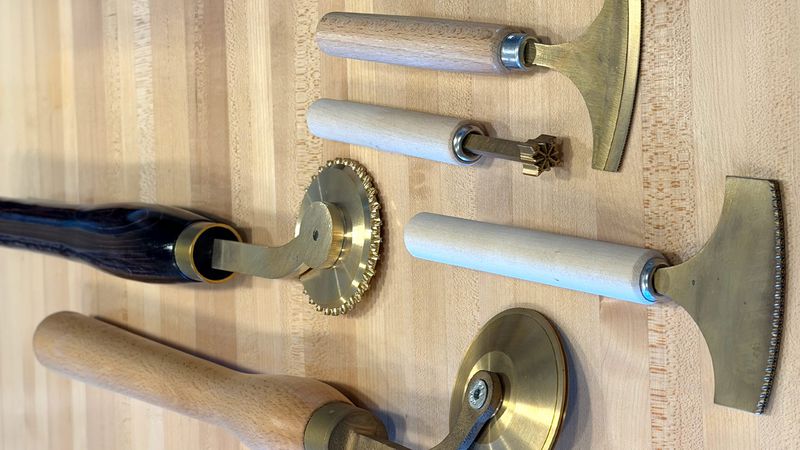 Brass finishing tools, rolls, and pallets.