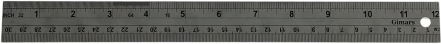 Measuring and cutting tools on a cutting mat.